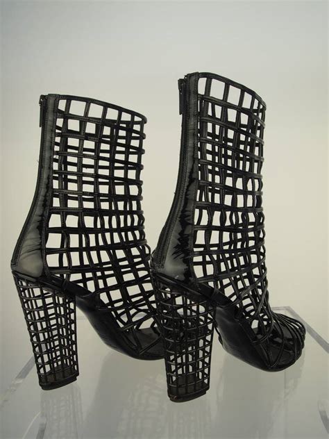 Yves Saint Laurent Patent Cage Booties .